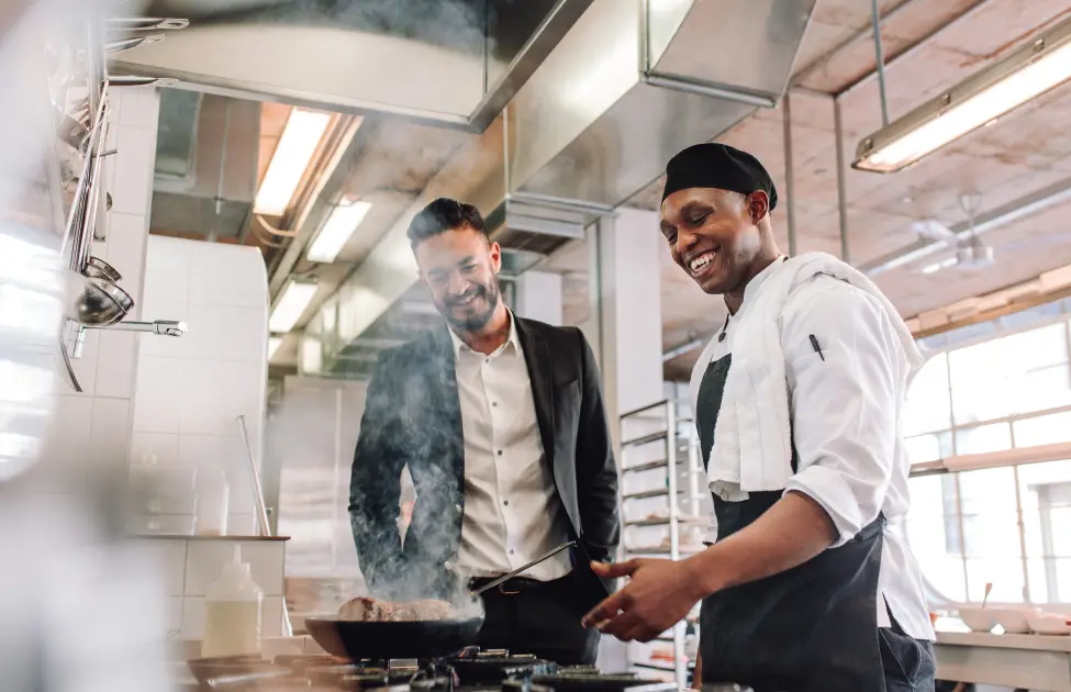 A Restaurant Manager and Chef Cooking in a Pest-Free Kitchen