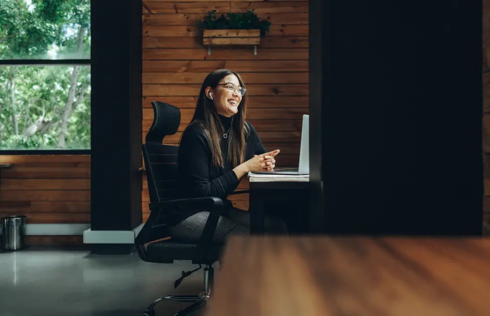 Happy Business Owner Working from Home in a Pest-Free Space