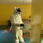 Twin Forks Pest Control® disinfecting a bedroom