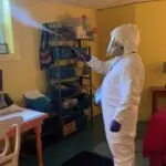 Twin Forks Pest Control® sprays disinfecting spray in home